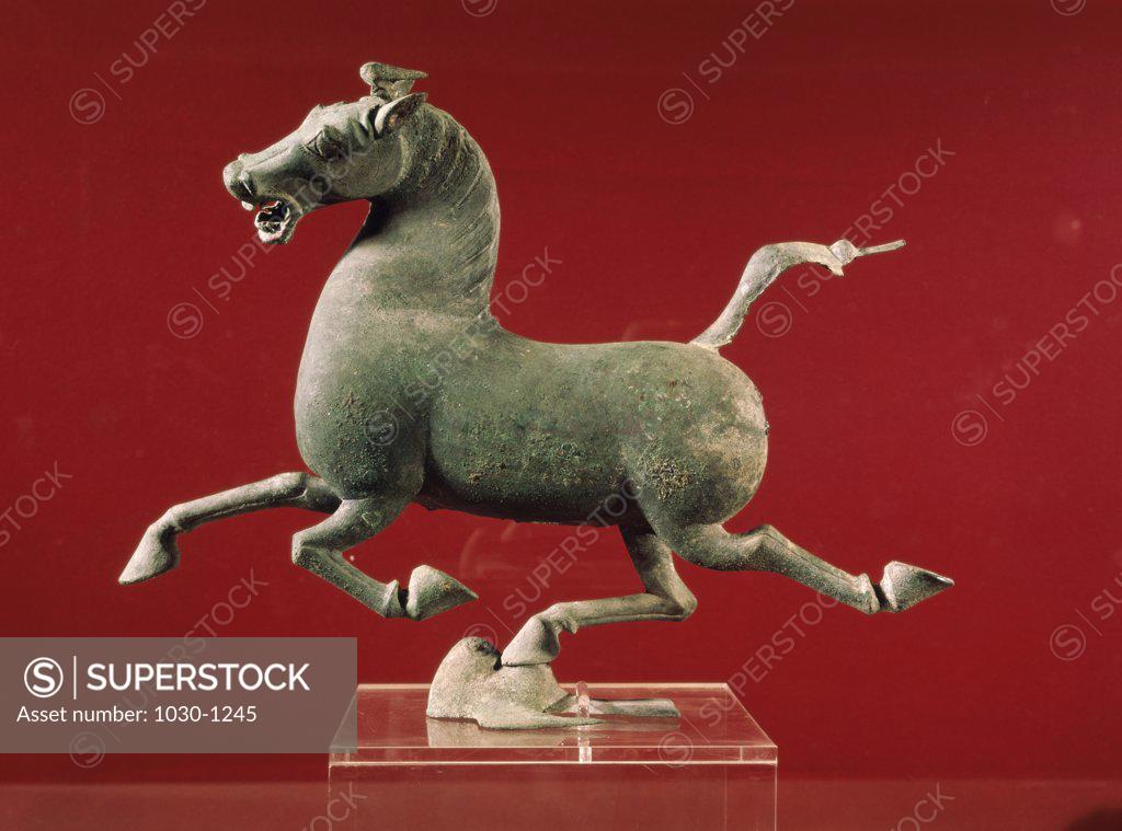 Stock Photo: 1030-1245 Running Horse, Right Rear Leg Balanced on a Swallow in Flight (Han Dynasty 206 B.C.-- 220 A.D.) Chinese art Bronze