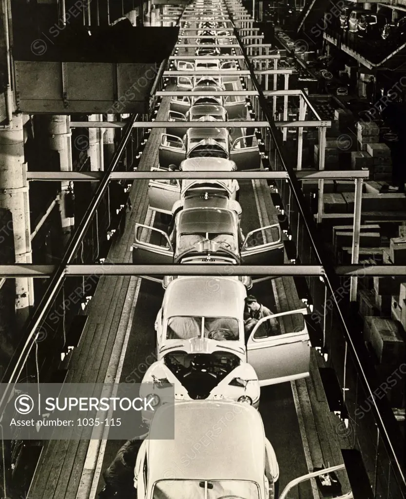 High angle view of manufactured cars on an assembly line in a factory, Dearborn, Michigan, USA, 1946