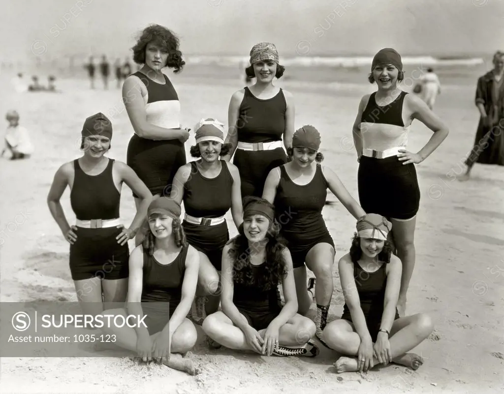 Portrait of a group of young women and teenage girls posing on the beach