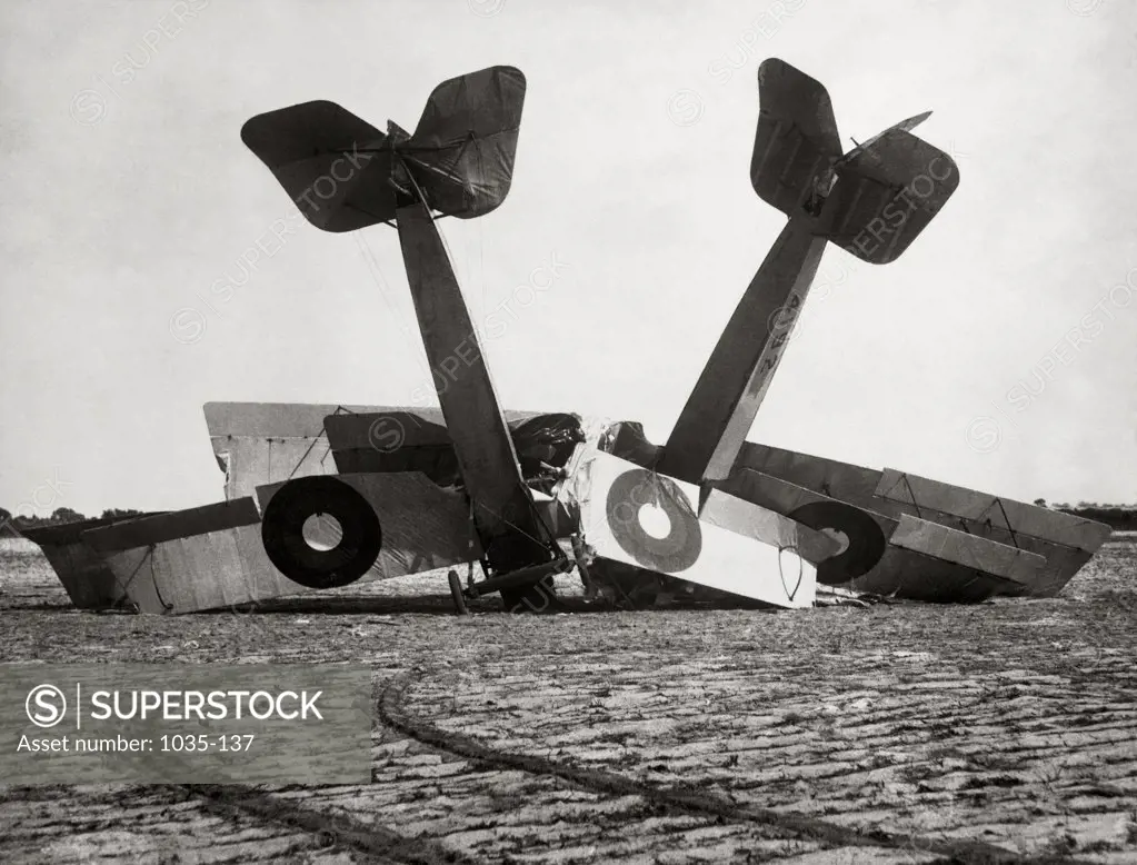 Two crashed biplanes in a field, 1919