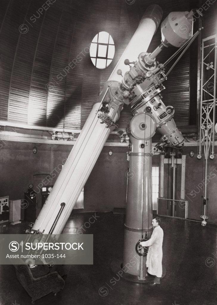 Stock Photo: 1035-144 Man looking through an refracting telescope, Berlin Observatory, Babelsberg, Germany
