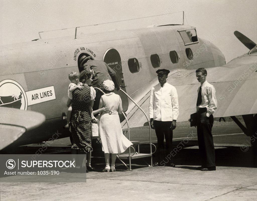 Stock Photo: 1035-190 Passengers boarding an airplane