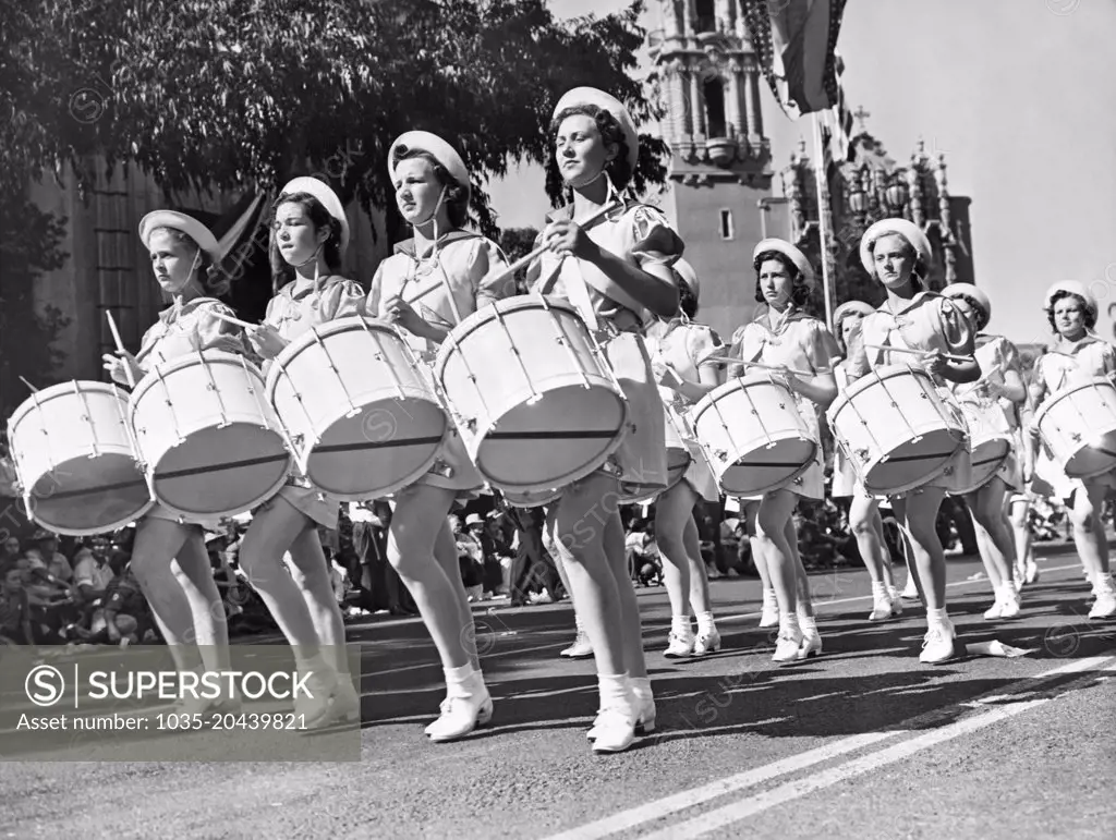 Los Angeles, California:  September 20, 1938 Members of the Southern Utah Girls' Drum and Bugle Corps as they march in the annual American Legion parade.