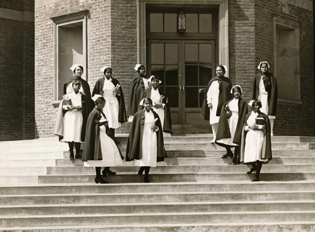 New York, New York:   c. 1929 African American nurses on the steps of the Lincoln Training School for Nurses at 141st Street and Southern Boulevard in the Bronx.