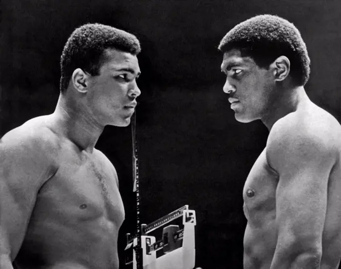 Houston, Texas:   February, 6, 1967. Heavyweight champion Cassius Clay focuses his whammy eye on challenger Ernie Terrell during the weigh in for tonight's title fight.