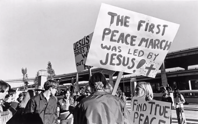 San Francisco, California:  c. 1968 People at a demonstration in Justin Herman Plaza protesting the war in Vietnam.