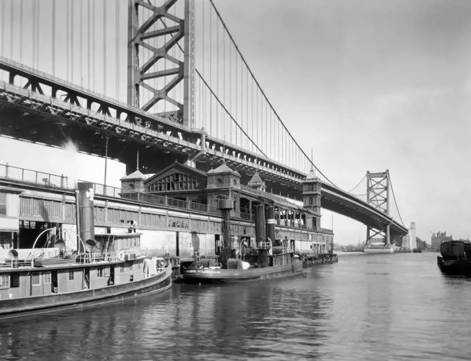 Philadelphia, Pennsylvania   c. 1926 The Benjamin Franklin Bridge over the Delaware River connecting Philadelphia and Camden, New Jersey.