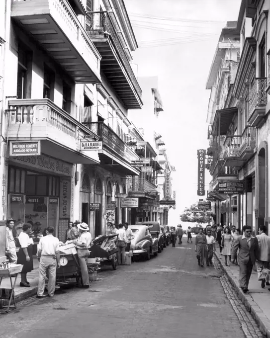 San Juan, Puerto Rico:  October 18, 1946 A street scene in Old San Juan. The cobblestones along the curbs were brought over centuries ago as ballast in the ships of the Conquistadores.