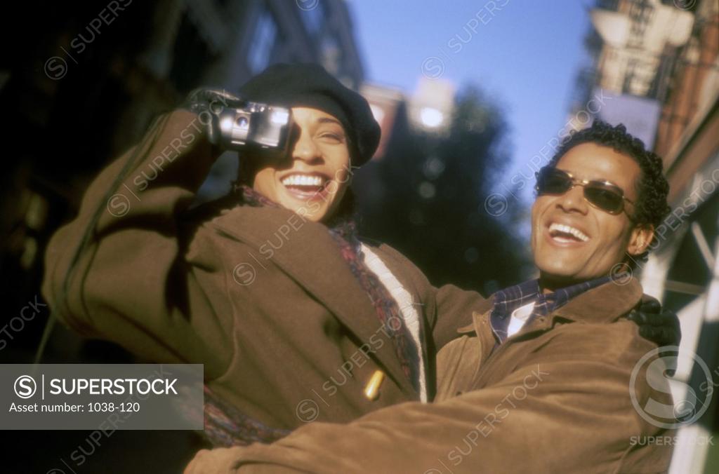 Stock Photo: 1038-120 Young couple holding each other
