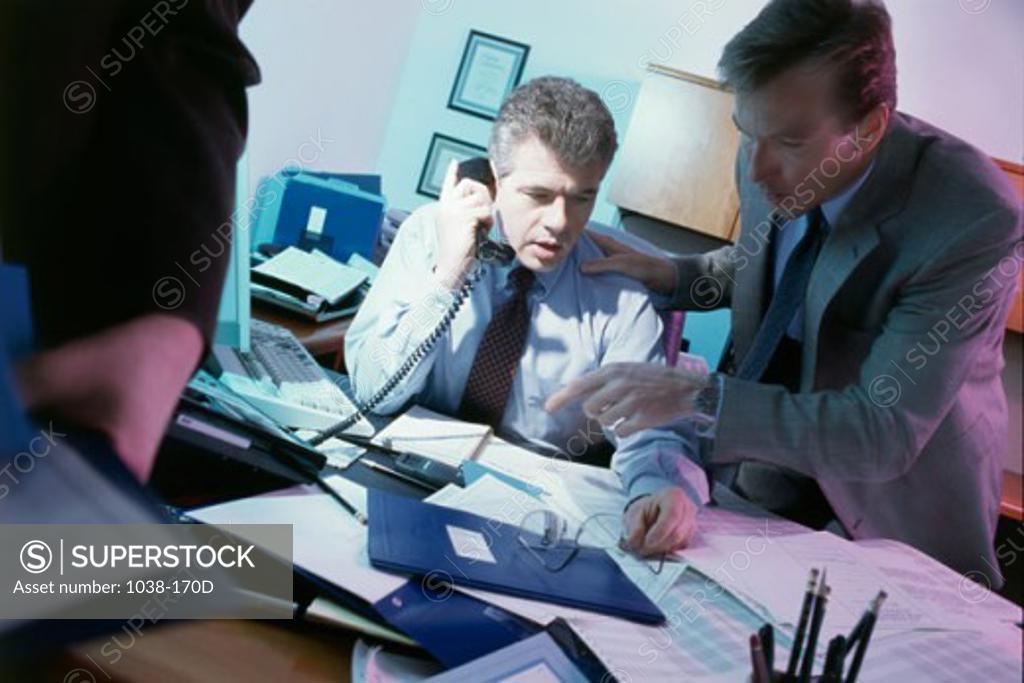 Stock Photo: 1038-170D Two businessmen in an office