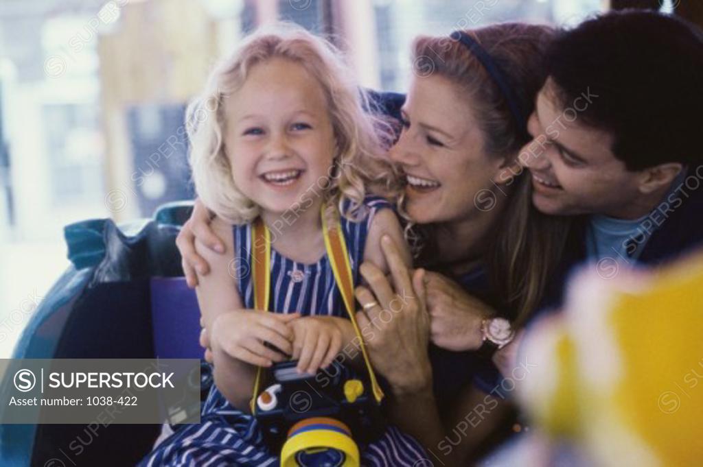 Stock Photo: 1038-422 Portrait of a girl smiling with her parents