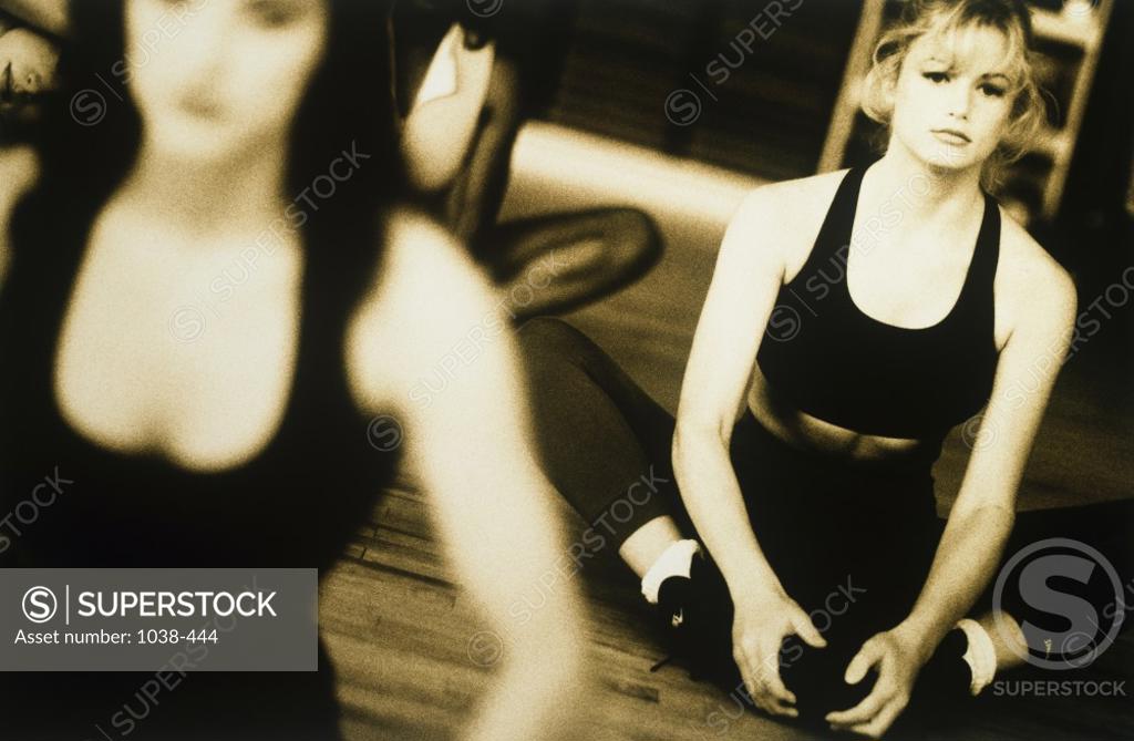 Stock Photo: 1038-444 Two young women exercising in a gym
