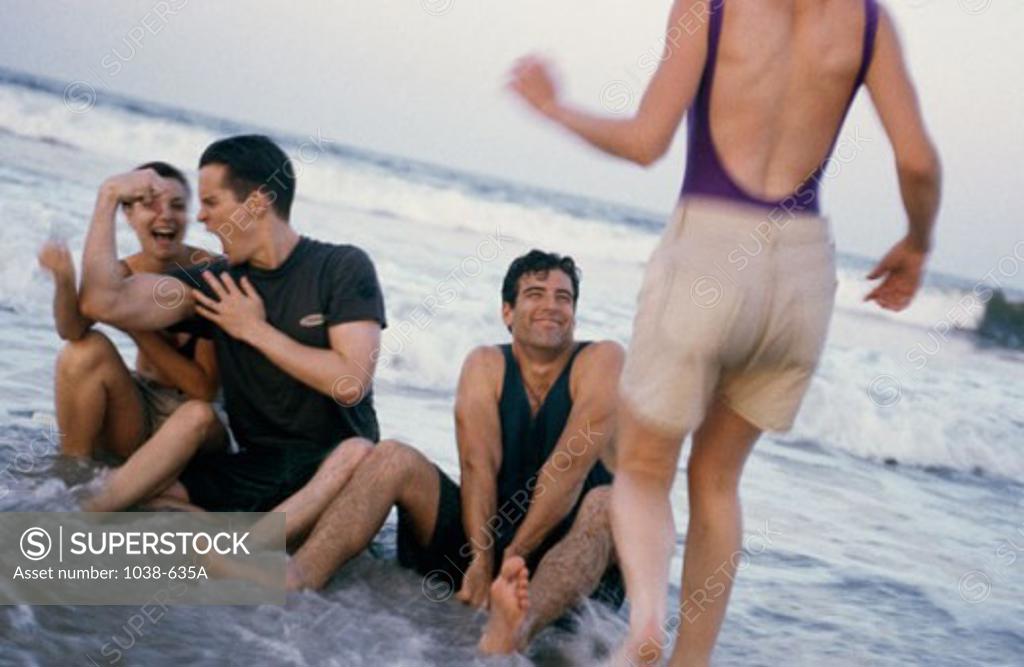 Stock Photo: 1038-635A Two young couples on the beach