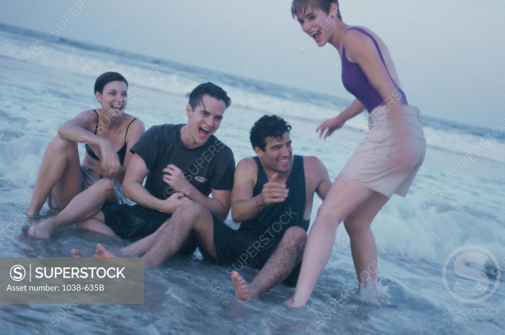 Stock Photo: 1038-635B Two young couples on the beach
