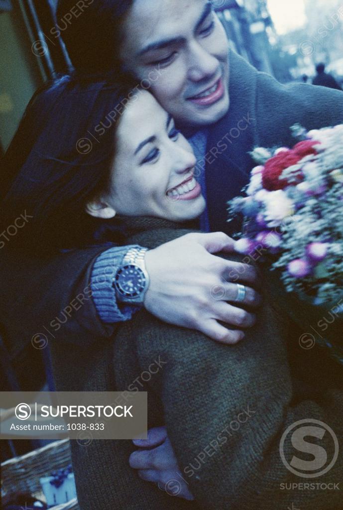 Stock Photo: 1038-833 Young couple hugging each other