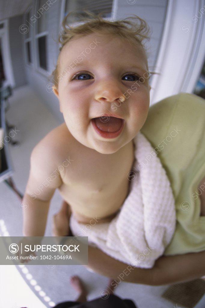 Stock Photo: 1042-10469A Portrait of a baby boy laughing