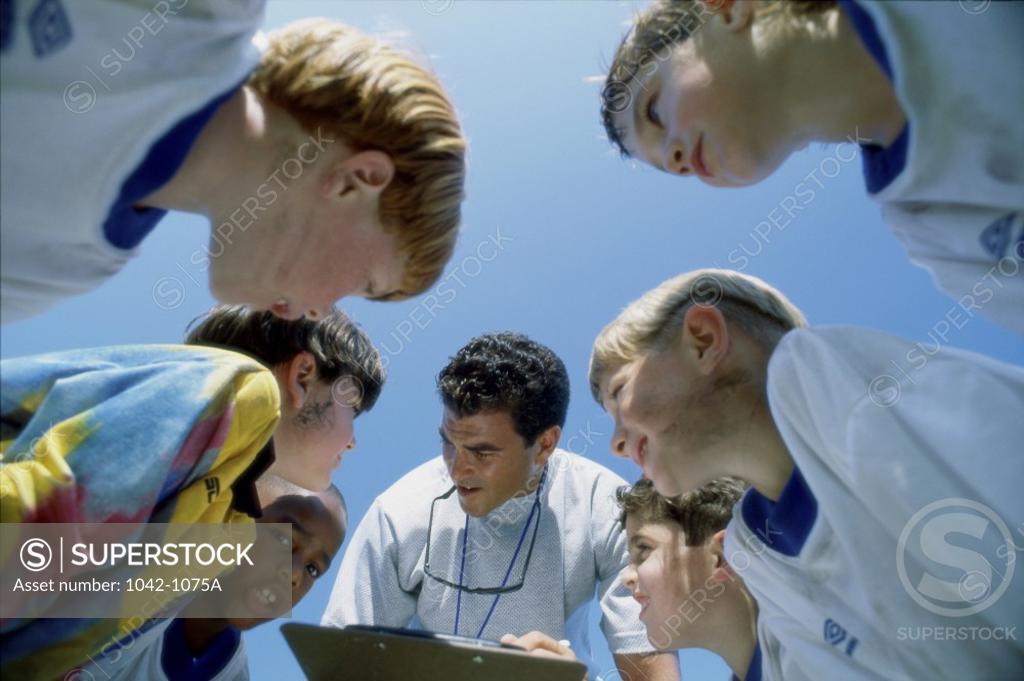 Stock Photo: 1042-1075A Low angle view of a team in a huddle
