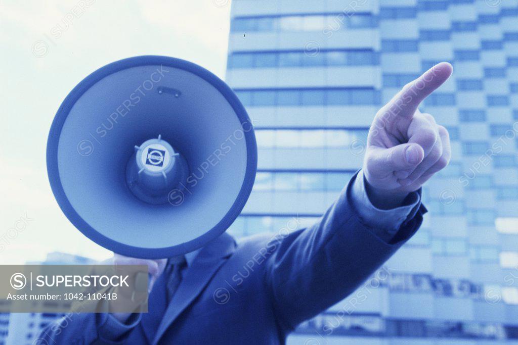 Stock Photo: 1042-11041B Businessman holding a megaphone