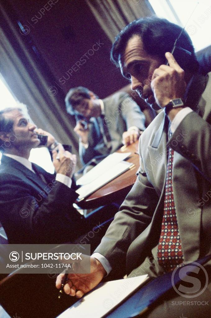 Stock Photo: 1042-1174A Three businessmen in an office