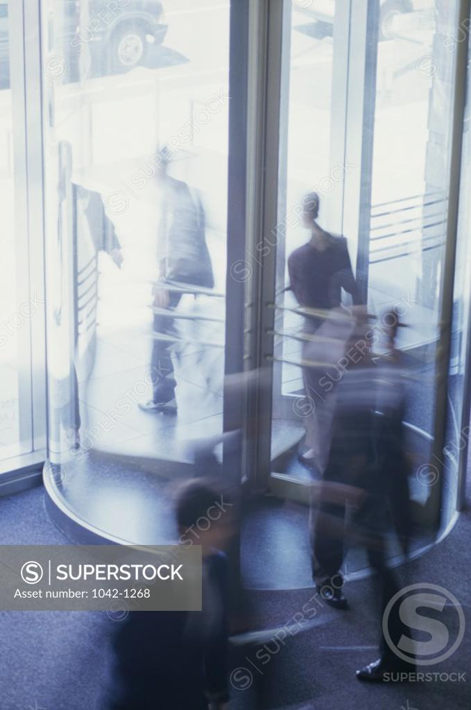 Stock Photo: 1042-1268 High angle view of business executives in a revolving door