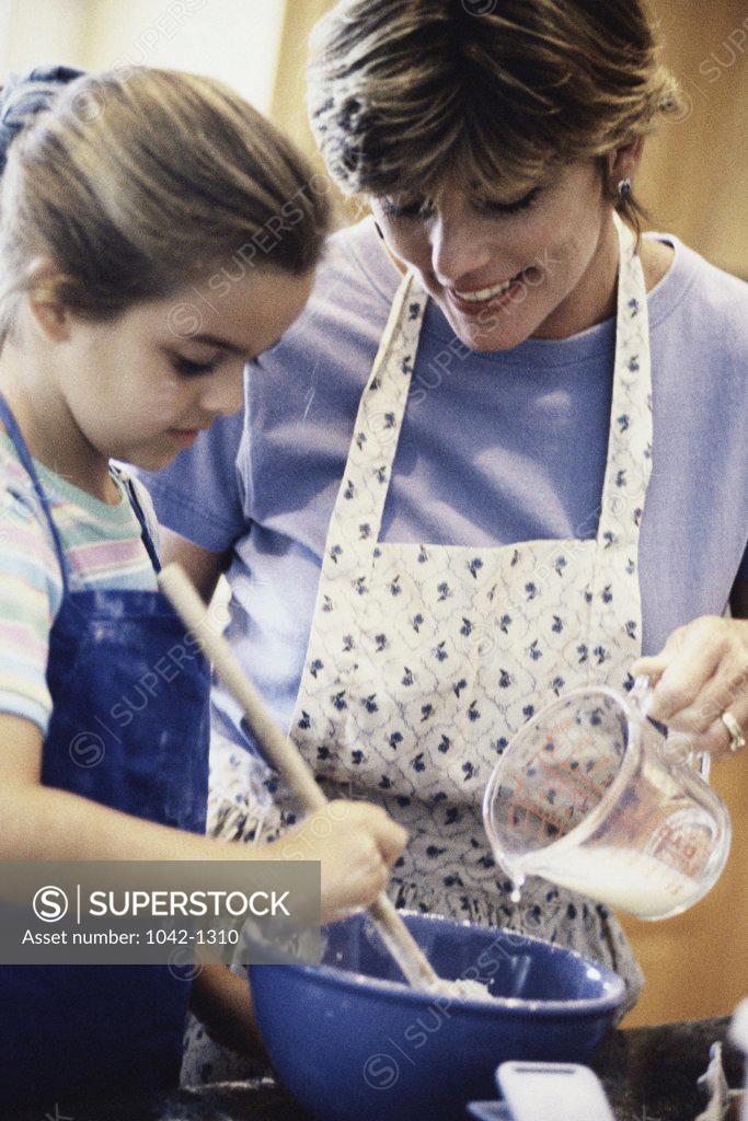 Stock Photo: 1042-1310 Mother baking with her daughter