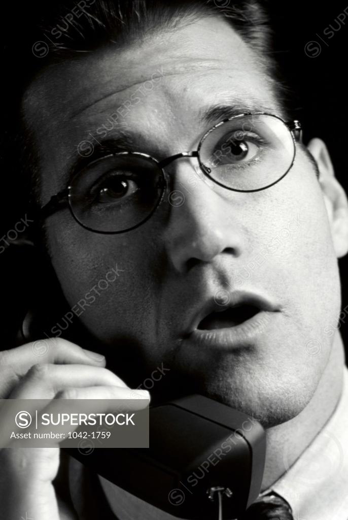 Stock Photo: 1042-1759 Close-up of a businessman talking on the telephone