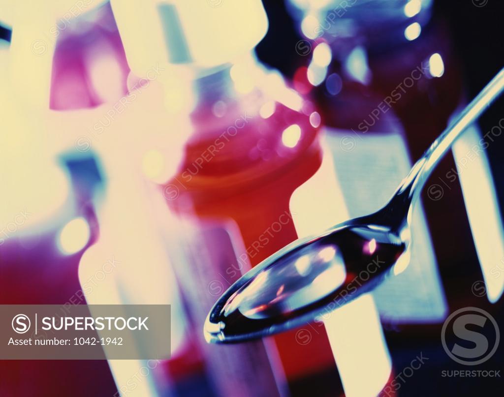 Stock Photo: 1042-1942 Close-up of syrup in a tablespoon