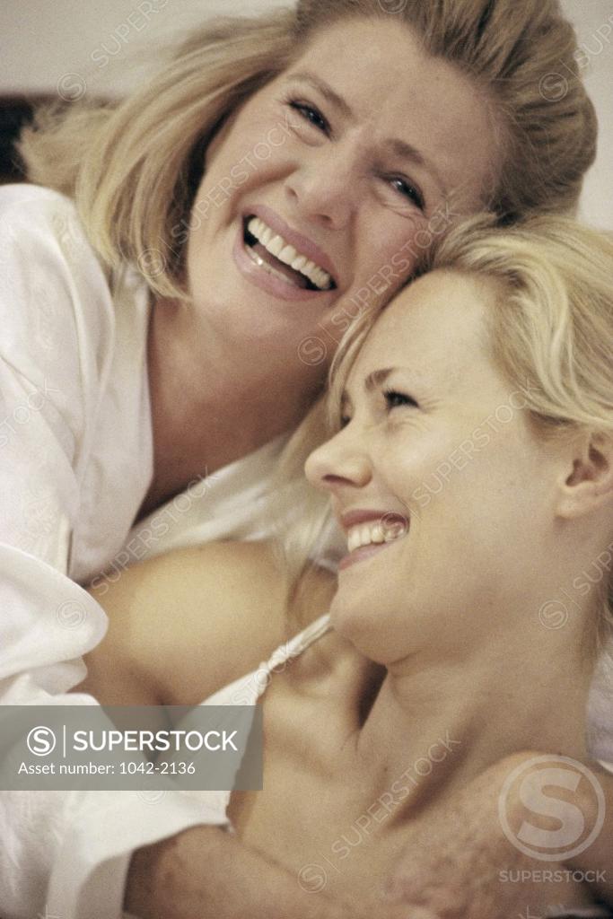 Stock Photo: 1042-2136 Close-up of a young woman hugging her mother