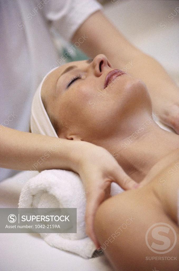 Stock Photo: 1042-2159A Close-up of a young woman getting a shoulder massage