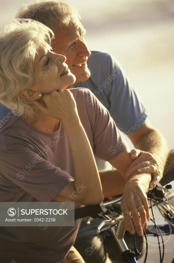 Stock Photo: 1042-2258 Senior couple on bicycles