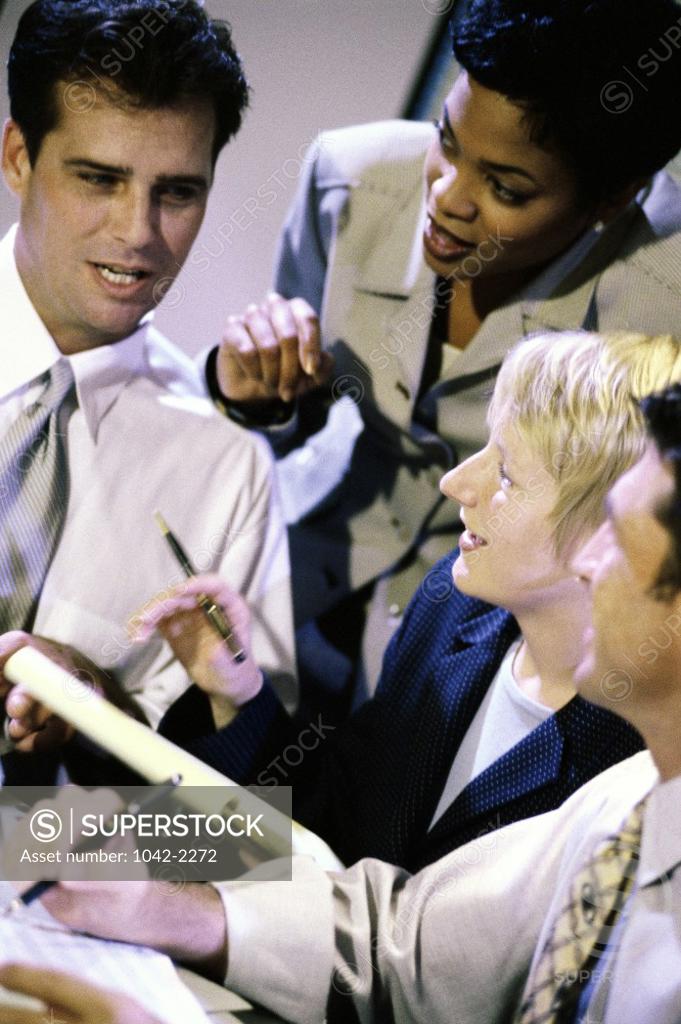 Stock Photo: 1042-2272 Two businessmen and two businesswomen in an office