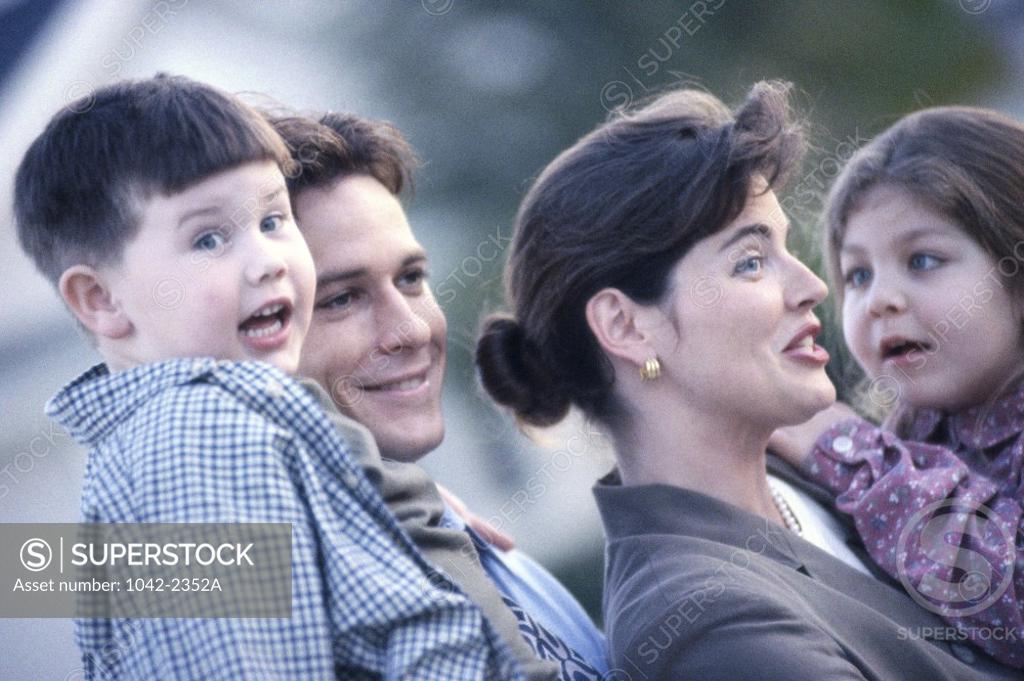 Stock Photo: 1042-2352A Parents holding their son and daughter