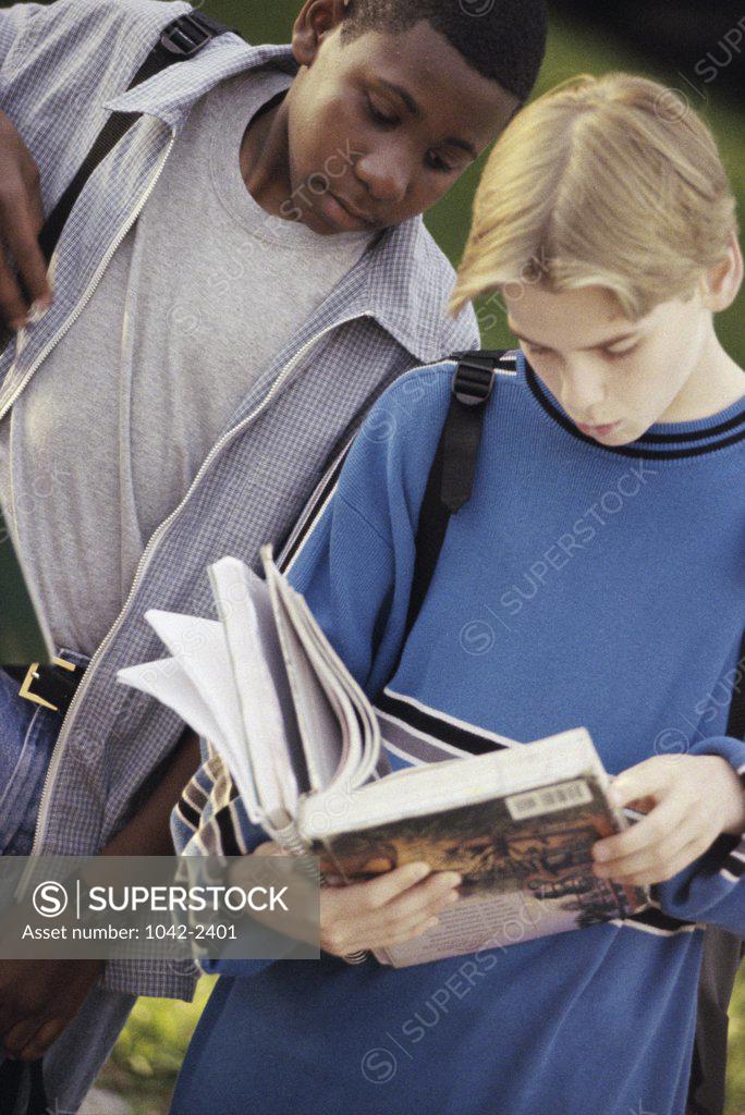 Stock Photo: 1042-2401 Two teenage boys standing side by side