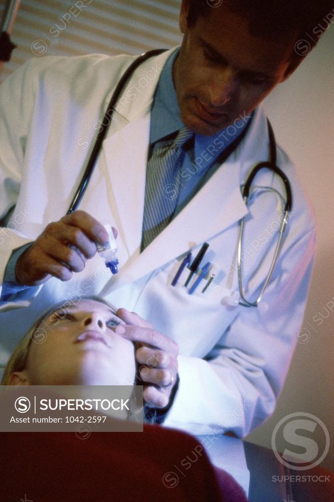 Stock Photo: 1042-2597 Male doctor treating a patient