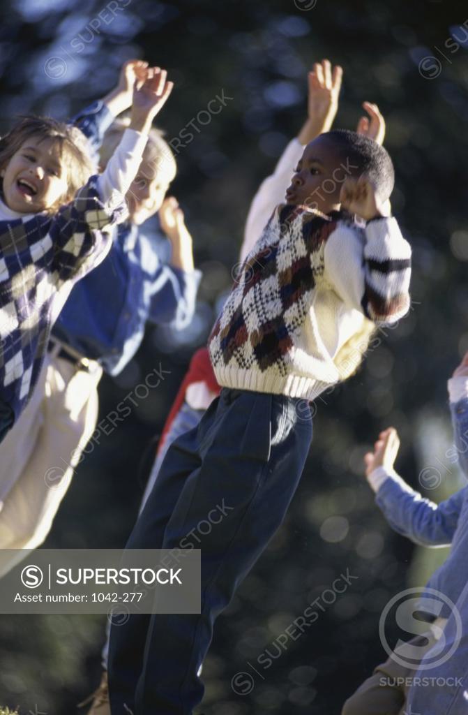 Stock Photo: 1042-277 Group of children jumping
