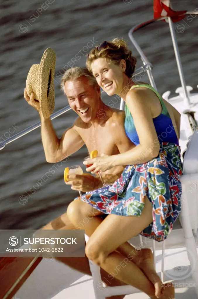 Mid adult couple celebrating together