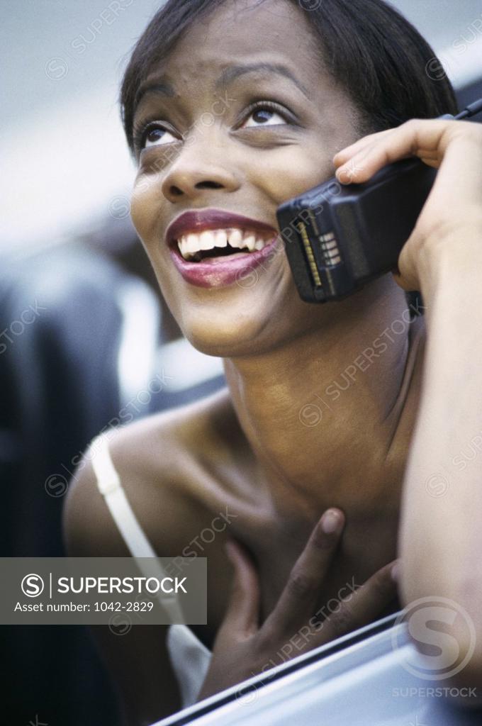 Stock Photo: 1042-2829 Young woman talking on a mobile phone