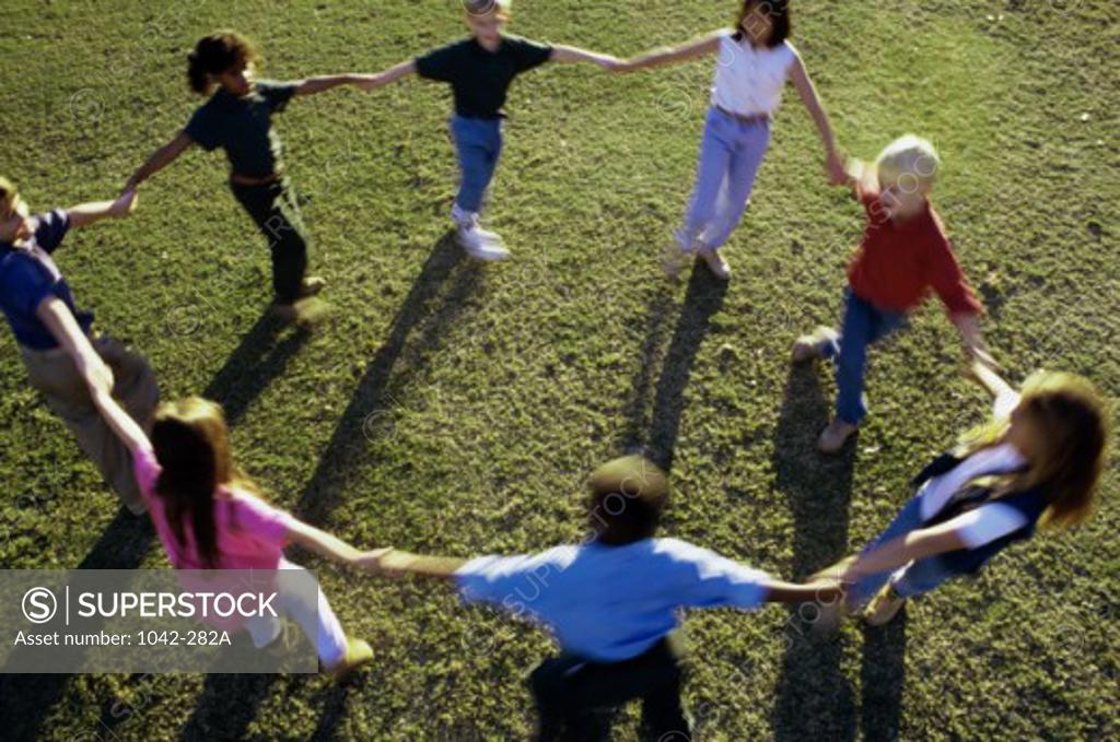 Stock Photo: 1042-282A High angle view of a group of children playing on a lawn
