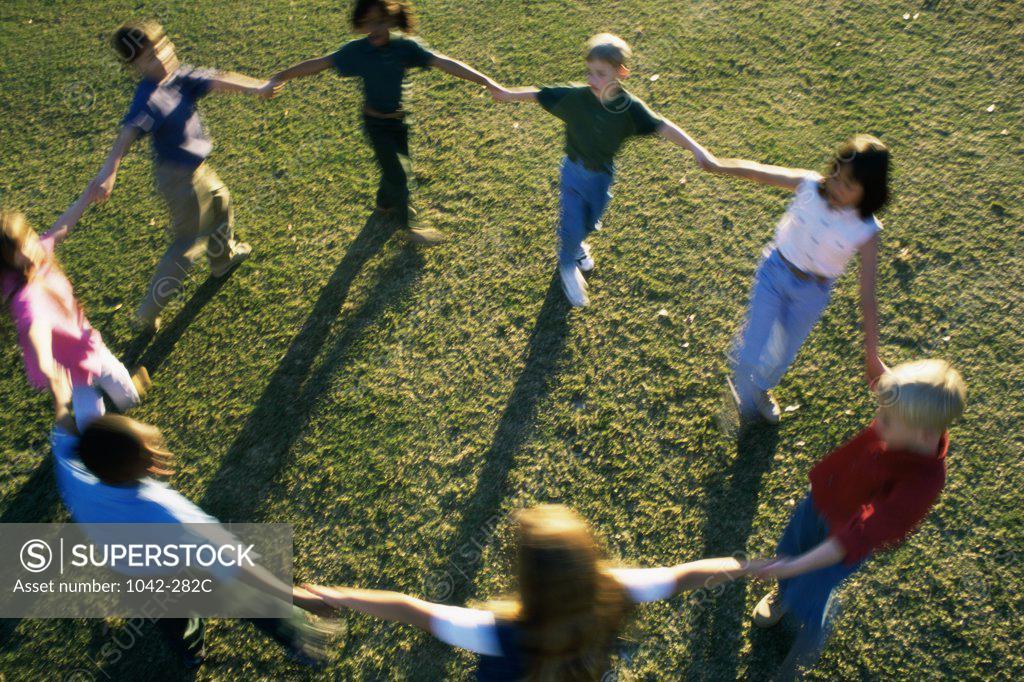 Stock Photo: 1042-282C High angle view of a group of children playing on a lawn