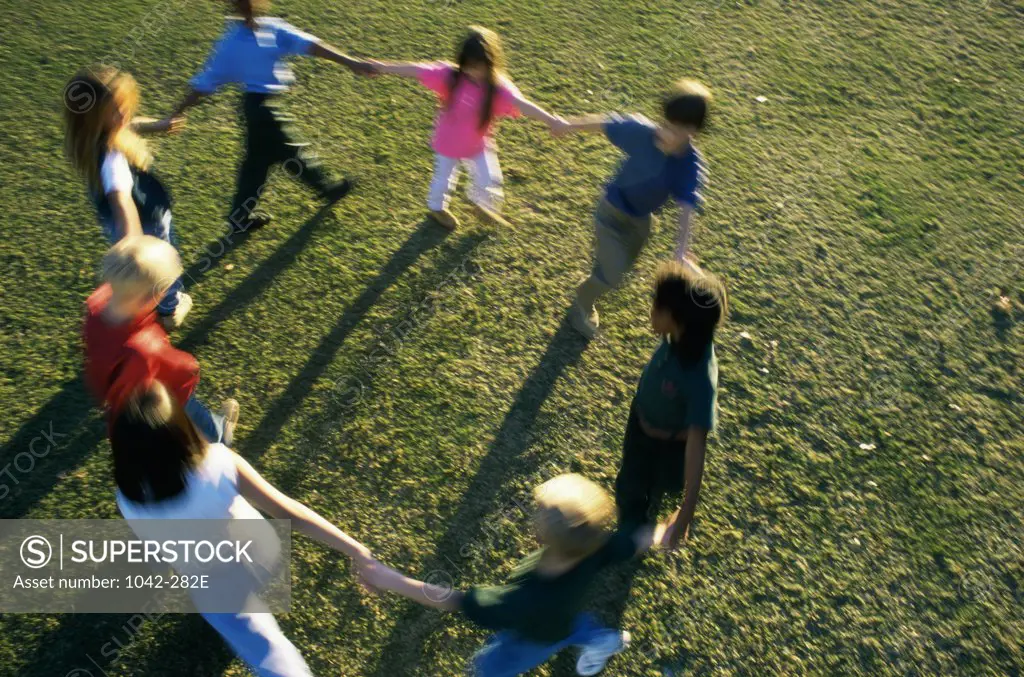 High angle view of a group of children playing on a lawn