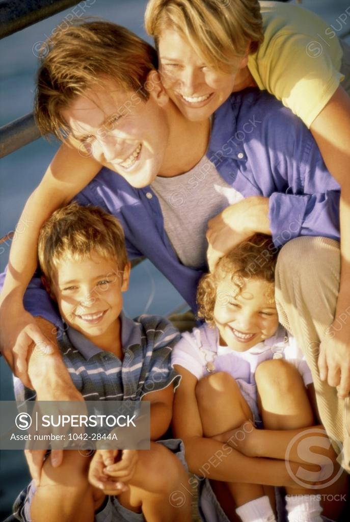 Stock Photo: 1042-2844A Parents with their two daughters