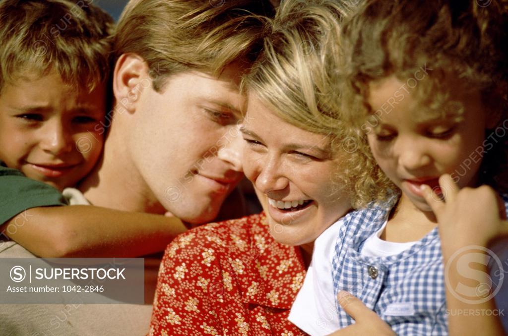 Stock Photo: 1042-2846 Parents holding their son and daughter