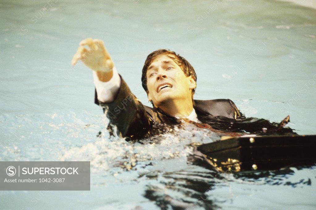 Stock Photo: 1042-3087 High angle view of a businessman drowning