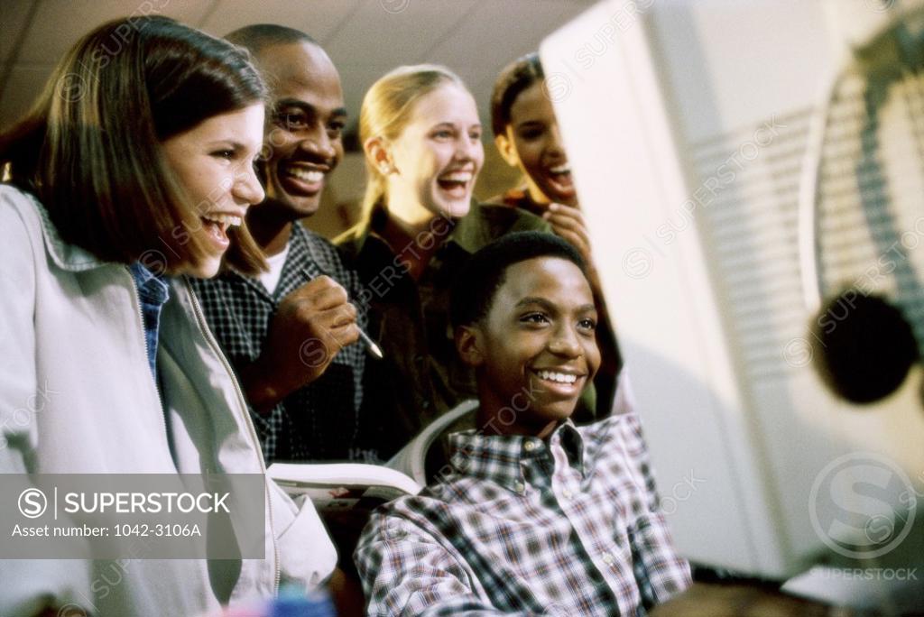 Stock Photo: 1042-3106A Group of teenagers in a computer class
