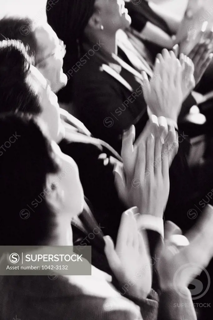 High angle view of business executives applauding