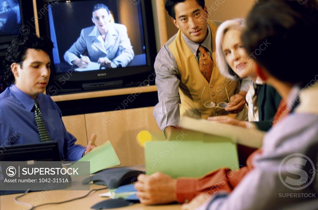 Stock Photo: 1042-3151A Group of business executives in a meeting