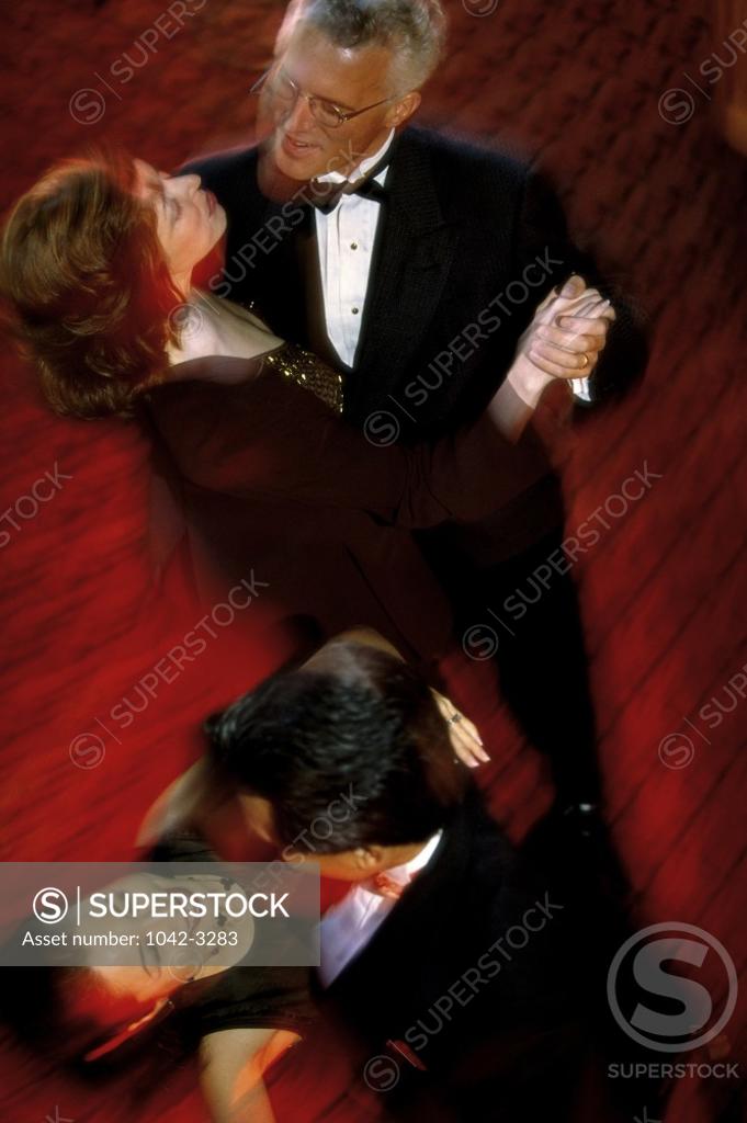 Stock Photo: 1042-3283 Two mature couples dancing