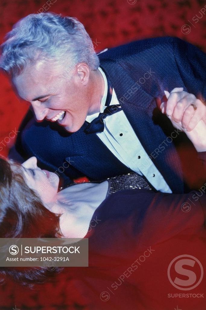 Stock Photo: 1042-3291A Close-up of a mid adult couple dancing