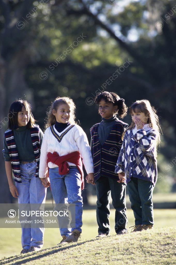 Stock Photo: 1042-334A Group of girls standing together on a lawn