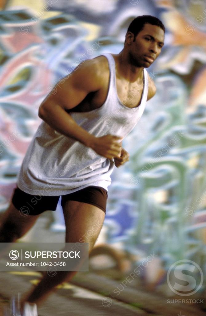 Stock Photo: 1042-3458 Side profile of a young man running